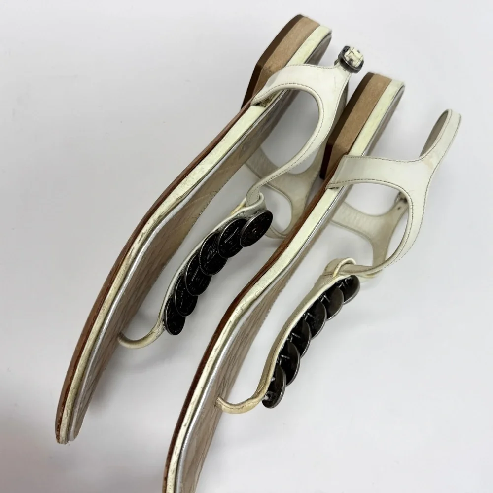 CHANEL White Leather Thong Sandals with Stacked Silver Coin Medallions